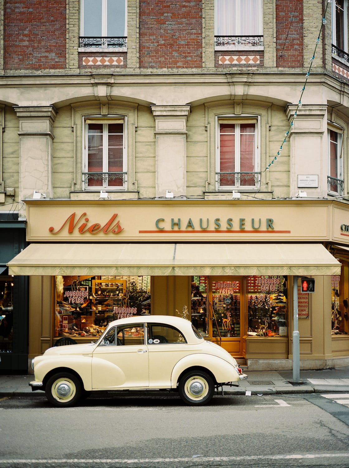 A beige car in front of the store, Niels Chausseur