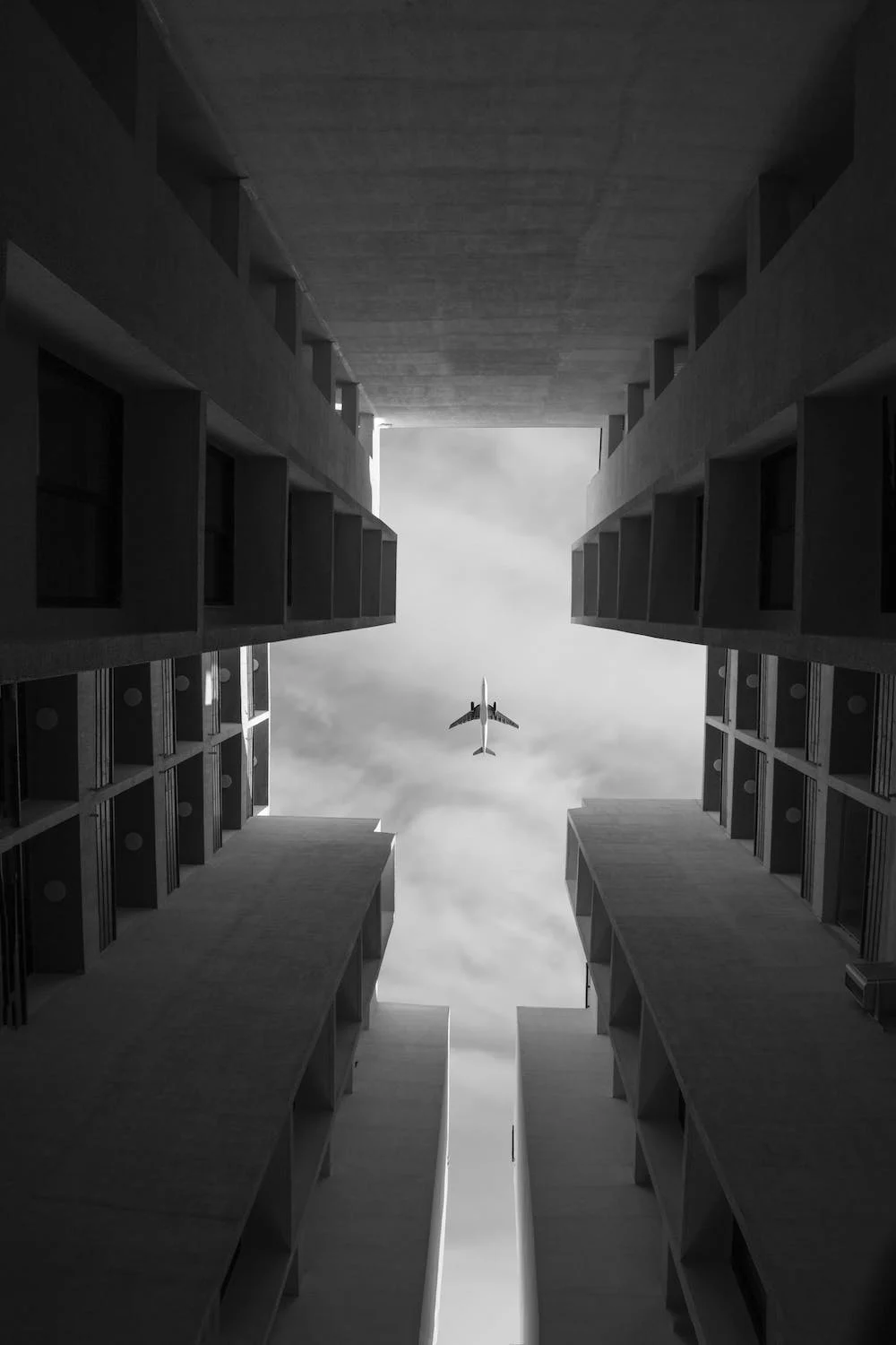 A plane above buildings